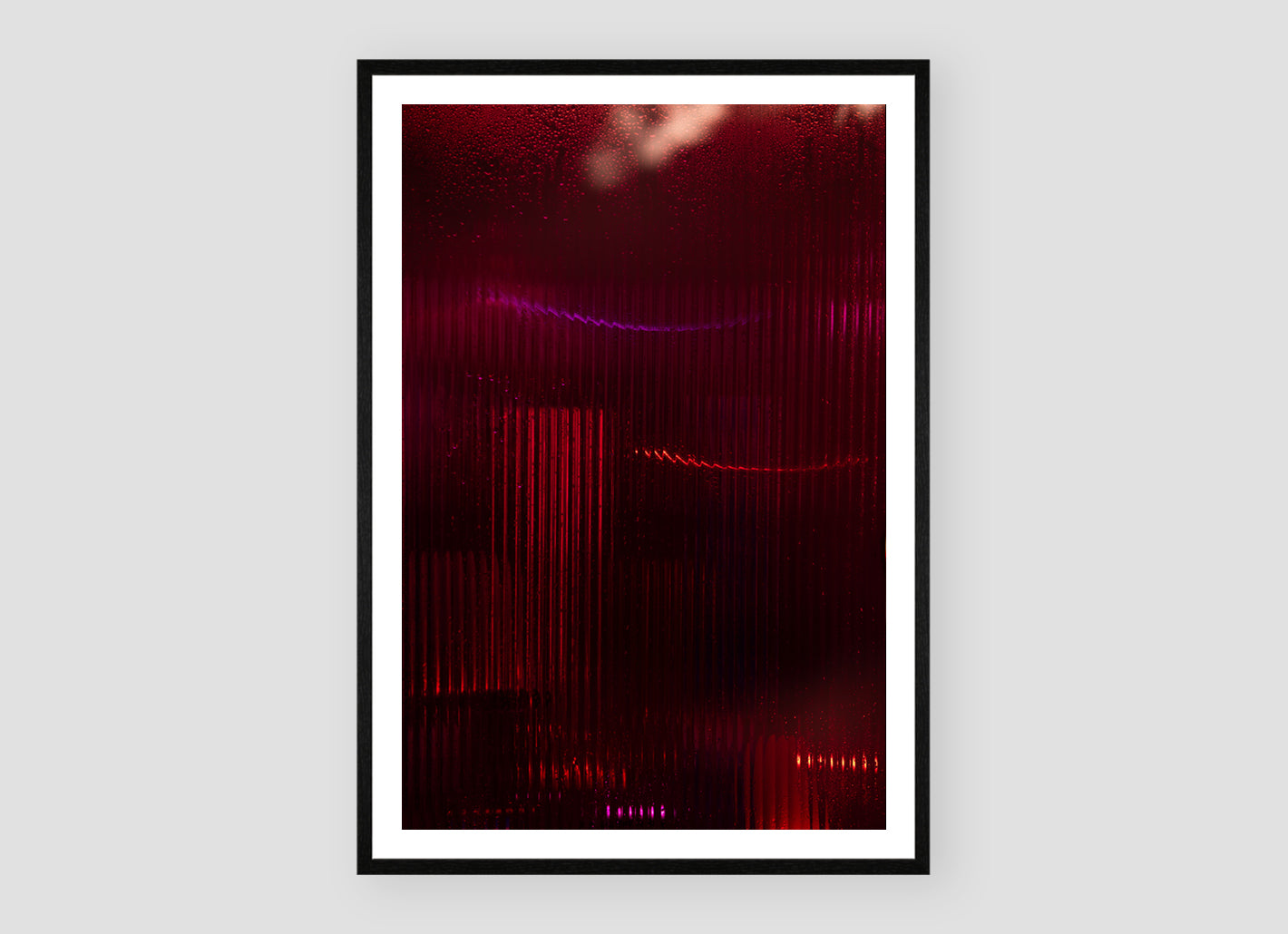 Diorama III by Bastiaan van Ederen, a photographic artwork transforming rain, crimson light and distant movement through fluted glass.